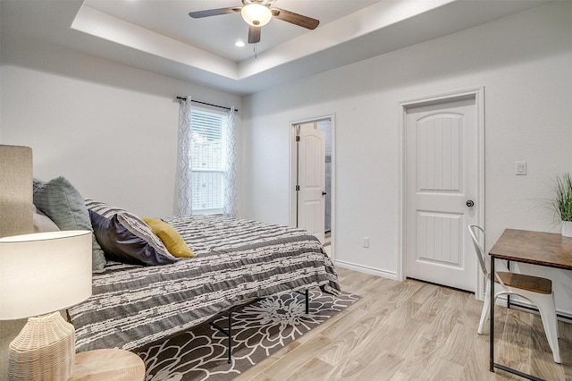 3108 Ridgecrest Dr, Granbury, TX 76048 - bedroom with a raised ceiling, light wood-style flooring, baseboards, a ceiling fan, and recessed lighting