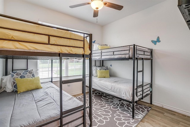 3108 Ridgecrest Dr, Granbury, TX 76048 - bedroom featuring baseboards, wood finished floors, and multiple windows