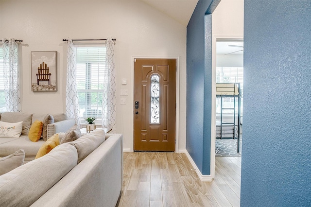 3108 Ridgecrest Dr, Granbury, TX 76048 - foyer featuring light wood-style floors, vaulted ceiling, and baseboards