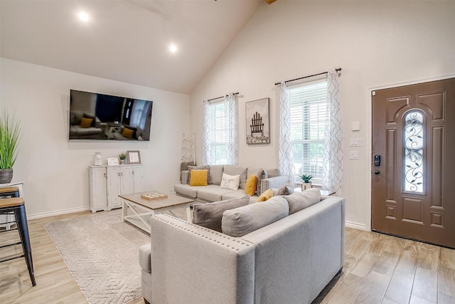 3108 Ridgecrest Dr, Granbury, TX 76048 - living area with high vaulted ceiling, light wood-type flooring, and baseboards