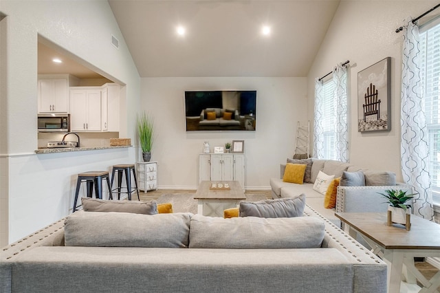 3108 Ridgecrest Dr, Granbury, TX 76048 - living room featuring baseboards, recessed lighting, and high vaulted ceiling