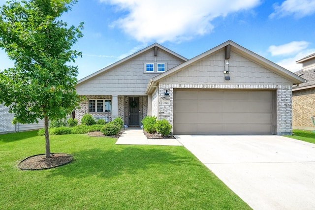 2246 Hartley Dr, Forney, TX 75126 - view of front of house featuring brick siding, a garage, a front yard, and concrete driveway