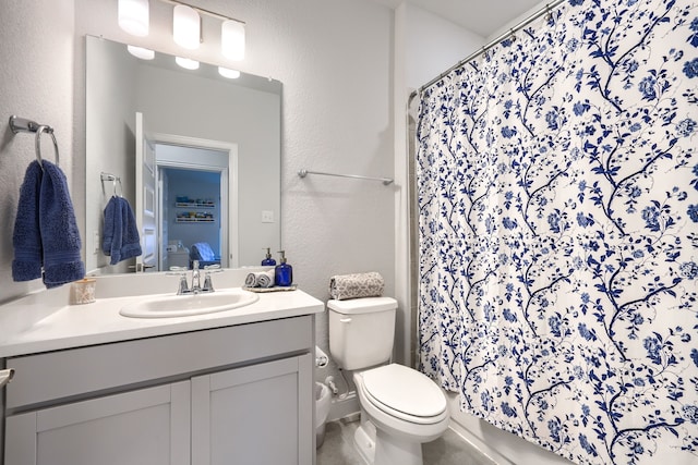 2246 Hartley Dr, Forney, TX 75126 - bathroom with vanity, toilet, a textured wall, and curtained shower
