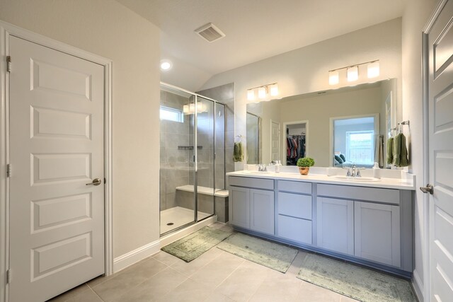 2246 Hartley Dr, Forney, TX 75126 - bathroom featuring plenty of natural light, a shower stall, tile patterned floors, and lofted ceiling