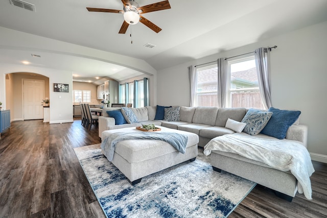 2246 Hartley Dr, Forney, TX 75126 - living room featuring arched walkways, lofted ceiling, dark wood-style flooring, and ceiling fan