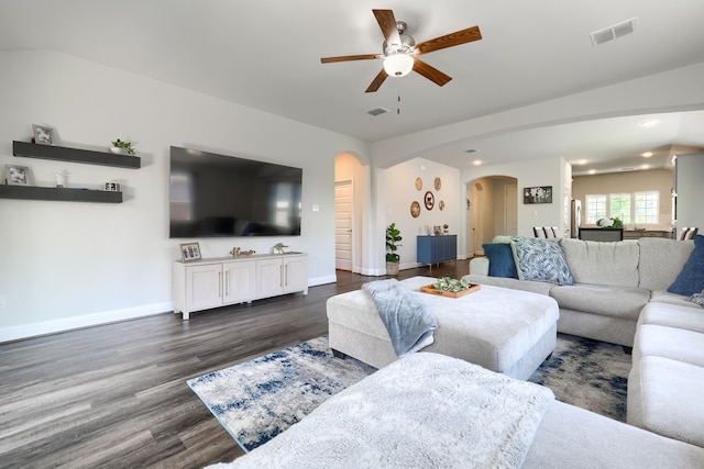 2246 Hartley Dr, Forney, TX 75126 - living room with arched walkways, a ceiling fan, dark wood-style floors, baseboards, and recessed lighting
