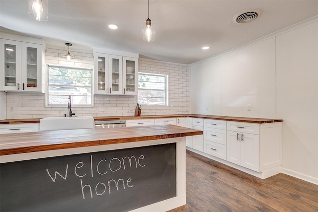 5712 Trail Lake Dr, Fort Worth, TX 76133 - kitchen with wooden counters, a sink, white cabinets, dark wood-style flooring, and decorative backsplash