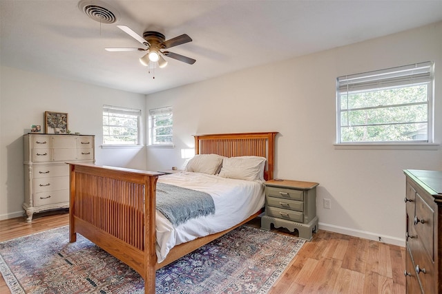 5712 Trail Lake Dr, Fort Worth, TX 76133 - bedroom with light wood finished floors, baseboards, and a ceiling fan