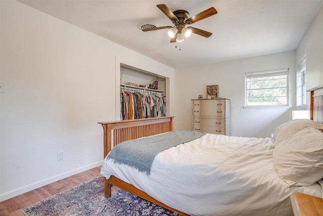 5712 Trail Lake Dr, Fort Worth, TX 76133 - bedroom featuring wood finished floors, baseboards, a closet, and ceiling fan