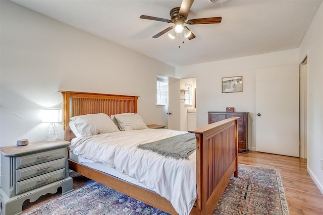 5712 Trail Lake Dr, Fort Worth, TX 76133 - bedroom with light wood-style flooring, ceiling fan, and connected bathroom