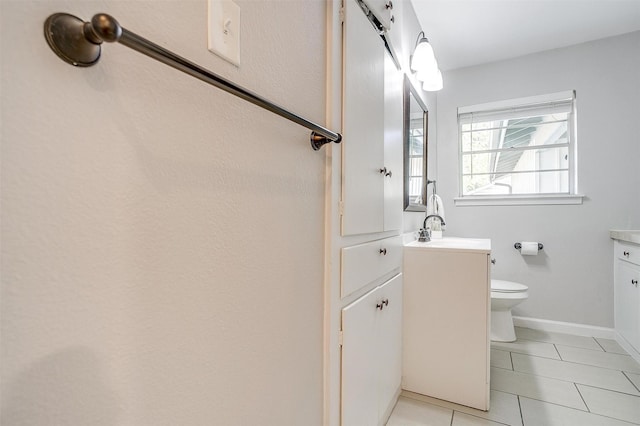 5712 Trail Lake Dr, Fort Worth, TX 76133 - bathroom featuring vanity, tile patterned flooring, toilet, and baseboards