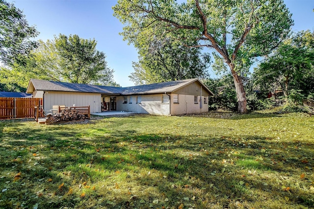 5712 Trail Lake Dr, Fort Worth, TX 76133 - rear view of property featuring board and batten siding and a patio