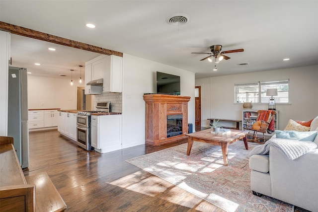 5712 Trail Lake Dr, Fort Worth, TX 76133 - living area with ceiling fan, recessed lighting, dark wood-type flooring, and a glass covered fireplace