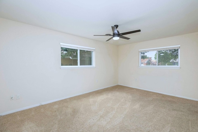 2489 Campus Ct, Abilene, TX 79601 - spare room featuring carpet flooring, ceiling fan, and baseboards
