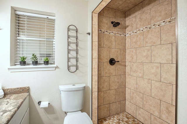 2489 Campus Ct, Abilene, TX 79601 - full bath featuring a tile shower, vanity, and toilet