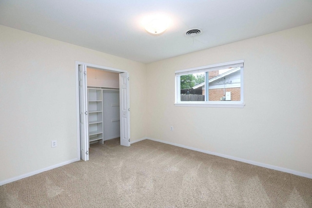 2489 Campus Ct, Abilene, TX 79601 - unfurnished bedroom featuring light colored carpet, baseboards, and a closet
