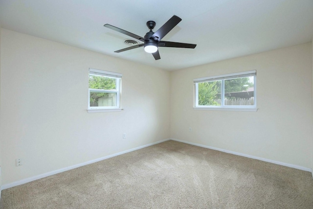 2489 Campus Ct, Abilene, TX 79601 - carpeted spare room with baseboards and a ceiling fan