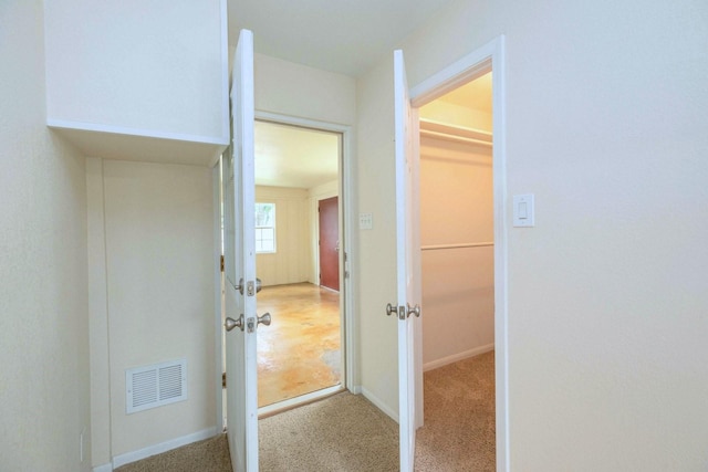 2489 Campus Ct, Abilene, TX 79601 - corridor featuring baseboards and carpet
