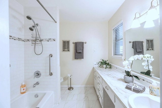 2489 Campus Ct, Abilene, TX 79601 - bathroom with vanity, shower / bath combination, marble look tiles, toilet, and baseboards