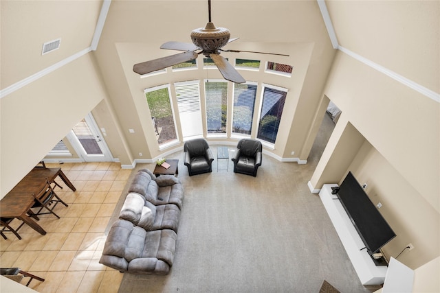 1050 Crystal Falls Dr, Prosper, TX 75078 - living area with a towering ceiling, ceiling fan, baseboards, and light tile patterned floors