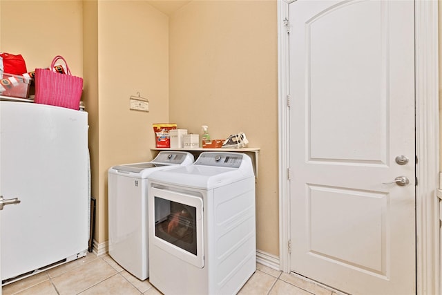 1050 Crystal Falls Dr, Prosper, TX 75078 - laundry area featuring light tile patterned floors and washer and clothes dryer