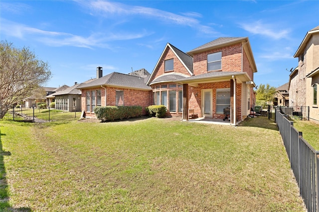 1050 Crystal Falls Dr, Prosper, TX 75078 - back of house featuring brick siding and a patio area