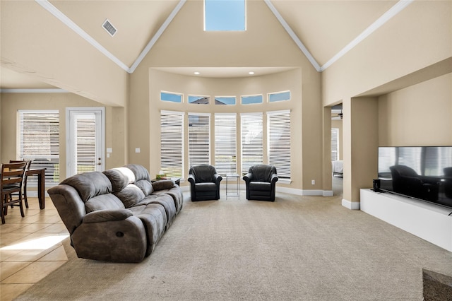 1050 Crystal Falls Dr, Prosper, TX 75078 - living area featuring high vaulted ceiling, light tile patterned flooring, crown molding, and baseboards