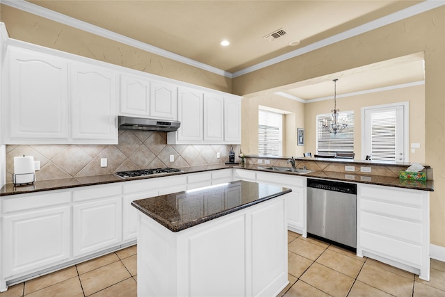 1050 Crystal Falls Dr, Prosper, TX 75078 - kitchen featuring stainless steel appliances, under cabinet range hood, a sink, decorative backsplash, and ornamental molding
