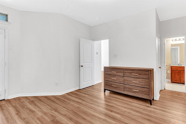 3724 Sicily St, Irving, TX 75038 - unfurnished bedroom with light wood finished floors, baseboards, ensuite bath, and a sink