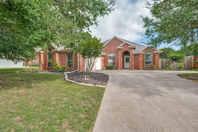 804 Lynhurst Ln, Denton, TX 76205 - view of front facade with an attached garage, concrete driveway, and brick siding