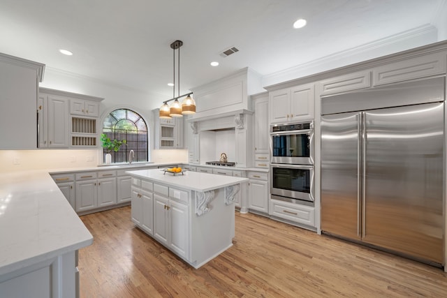 5934 Shy Dr, Frisco, TX 75034 - kitchen with stainless steel appliances, ornamental molding, open shelves, recessed lighting, and hanging light fixtures