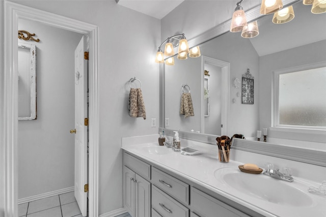 1125 Starling Ct, Burleson, TX 76028 - bathroom with double vanity, tile patterned floors, and baseboards
