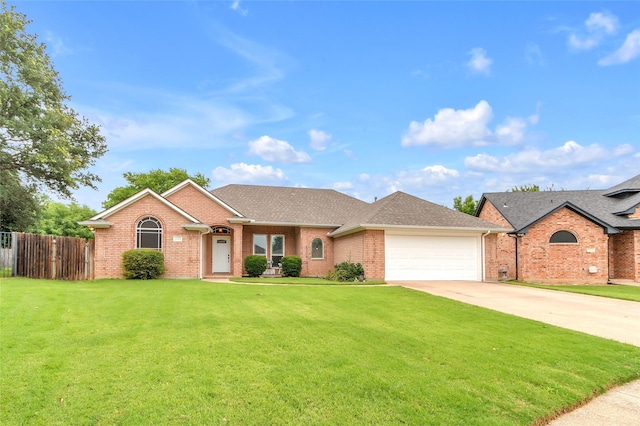 1125 Starling Ct, Burleson, TX 76028 - single story home featuring an attached garage, driveway, brick siding, and roof with shingles