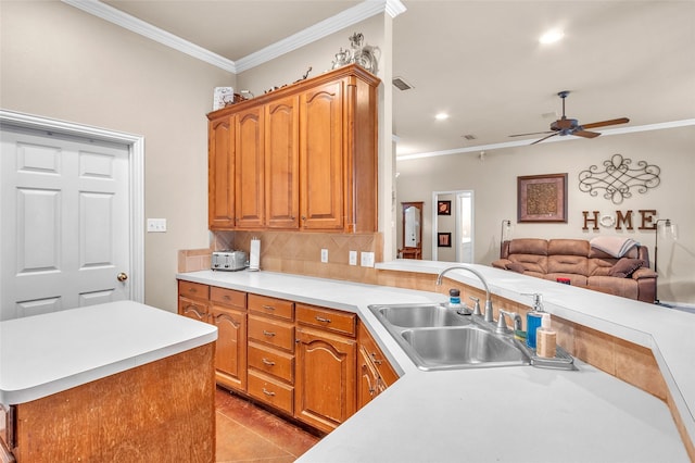 1125 Starling Ct, Burleson, TX 76028 - kitchen with ornamental molding, a sink, open floor plan, a ceiling fan, and light countertops