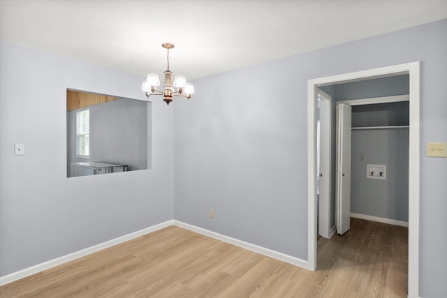 209 Circle Dr, Alvarado, TX 76009 - spare room with light wood-type flooring, a chandelier, and baseboards