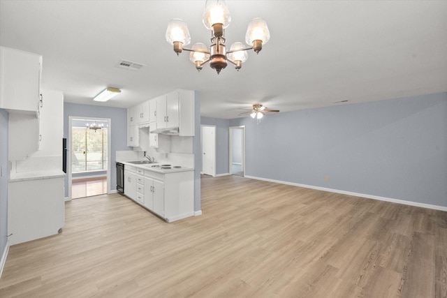 209 Circle Dr, Alvarado, TX 76009 - kitchen featuring a chandelier, light countertops, and white cabinetry