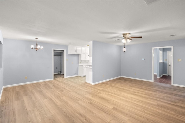 209 Circle Dr, Alvarado, TX 76009 - unfurnished living room featuring a chandelier, ceiling fan, light wood-type flooring, and baseboards