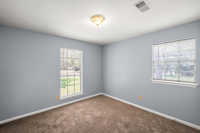 209 Circle Dr, Alvarado, TX 76009 - carpeted empty room featuring plenty of natural light and baseboards