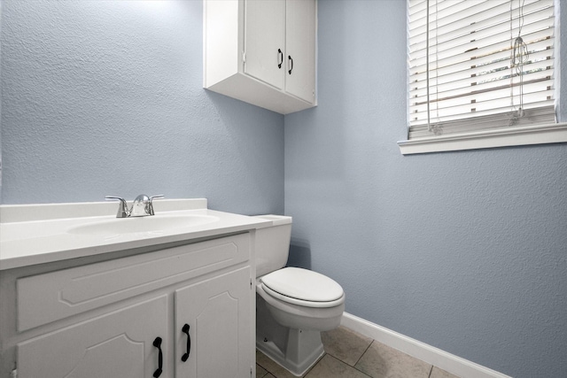 209 Circle Dr, Alvarado, TX 76009 - bathroom featuring toilet, vanity, tile patterned floors, baseboards, and a textured wall