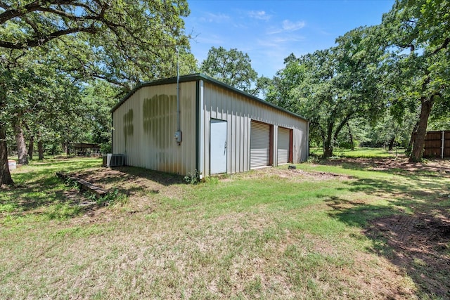 209 Circle Dr, Alvarado, TX 76009 - detached garage featuring central AC unit