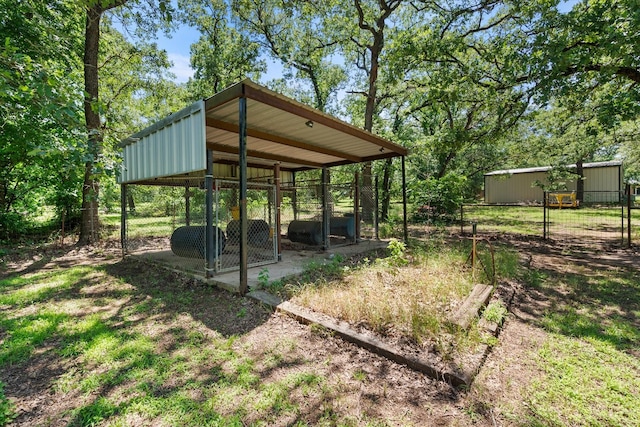 209 Circle Dr, Alvarado, TX 76009 - view of yard with an outdoor structure and a carport