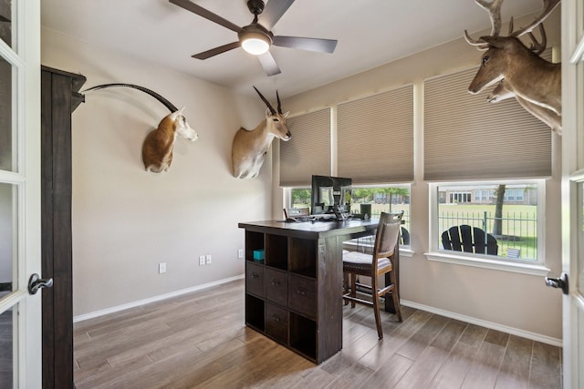 6173 Arcadia Park Ln, Frisco, TX 75036 - dining space featuring a desk, wood finished floors, ceiling fan, and baseboards