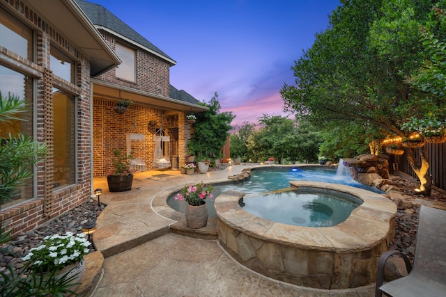 4452 Druid Hills Dr, Frisco, TX 75034 - pool at dusk with a patio and a pool with connected hot tub