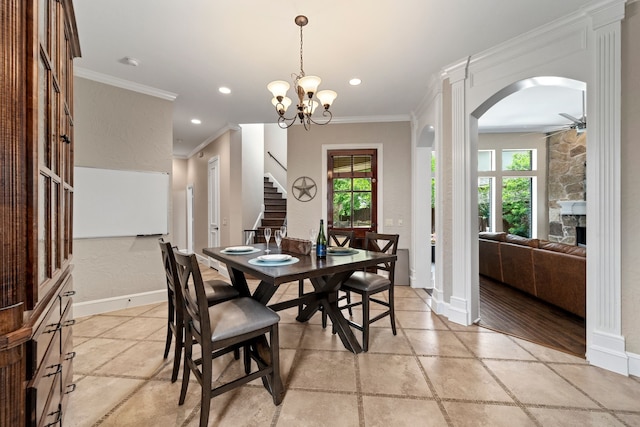 4452 Druid Hills Dr, Frisco, TX 75034 - dining space with ceiling fan, crown molding, stairway, baseboards, and arched walkways