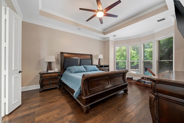 4452 Druid Hills Dr, Frisco, TX 75034 - bedroom with a tray ceiling, dark wood-style floors, baseboards, ornamental molding, and ceiling fan