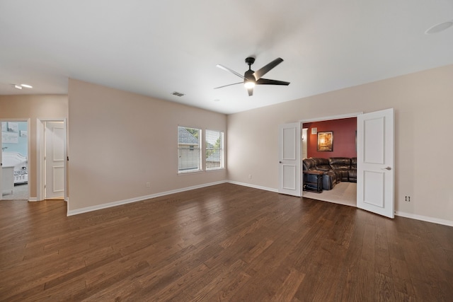 4452 Druid Hills Dr, Frisco, TX 75034 - unfurnished living room featuring dark wood finished floors, ceiling fan, and baseboards