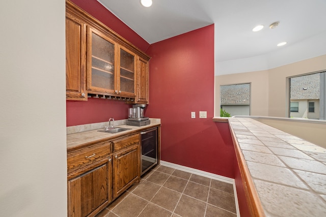 4452 Druid Hills Dr, Frisco, TX 75034 - bar area with wine cooler, a sink, baseboards, recessed lighting, and dark tile patterned floors