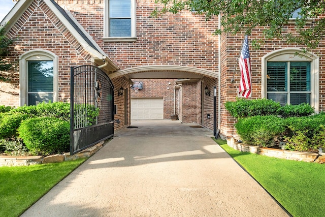 4452 Druid Hills Dr, Frisco, TX 75034 - property entrance featuring driveway, brick siding, and a garage