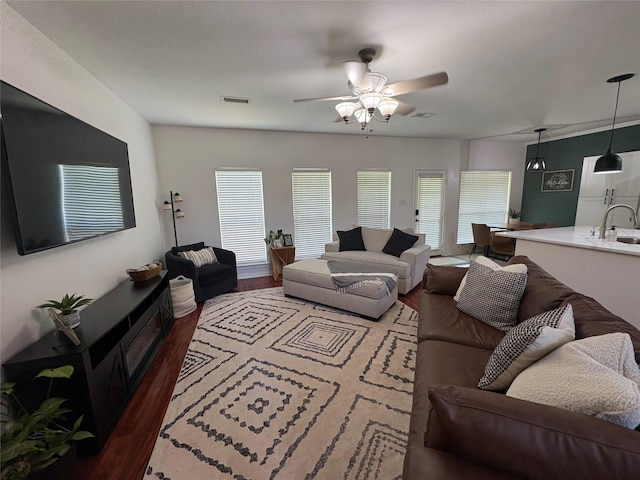 702 John Thomas Dr, Keene, TX 76059 - living area featuring wood finished floors and a ceiling fan