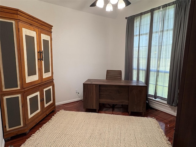 702 John Thomas Dr, Keene, TX 76059 - office area with a ceiling fan, dark wood-style flooring, and baseboards